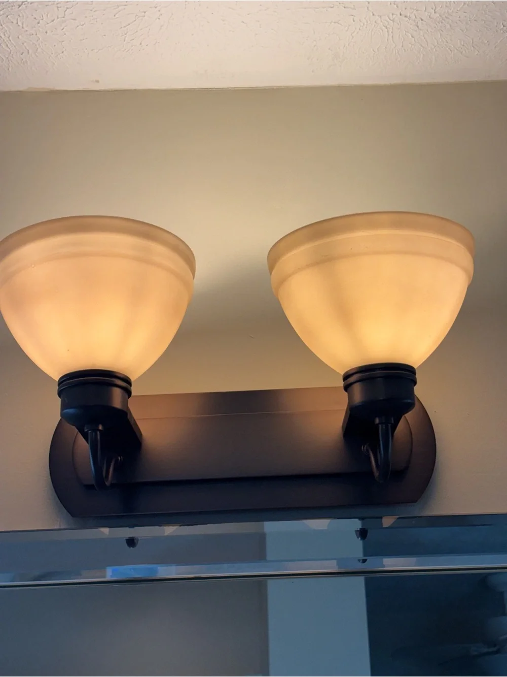 2-Light Bathroom Vanity Wall Light Rubbed Bronze with Beige Glass Shades. (3)